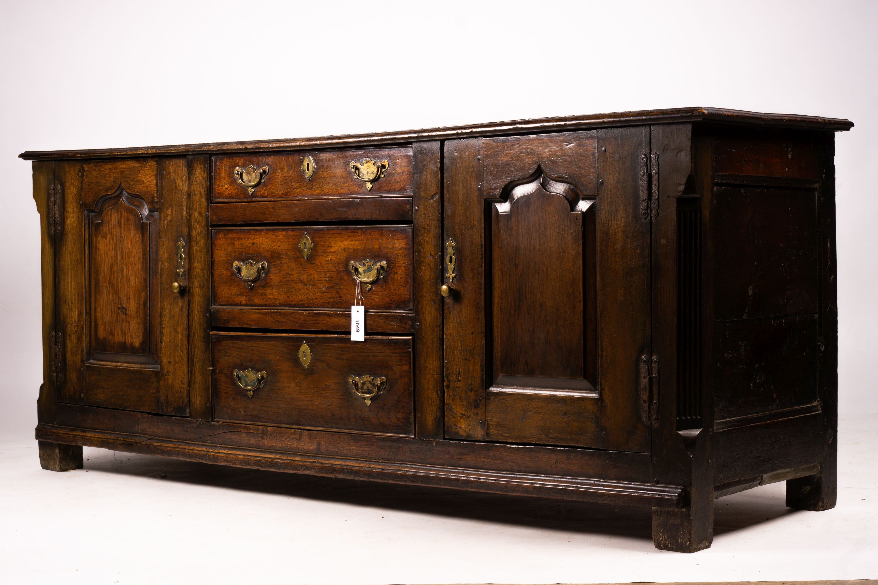 An 18th century oak low dresser base, length 191cm, depth 56cm, height 78cm